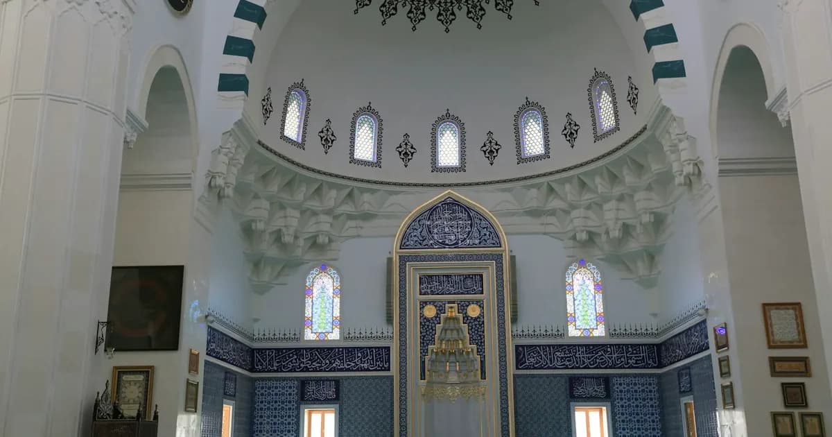 Grand mosque interior with domed ceiling, reflecting the precision behind makharij al-huruf articulation points