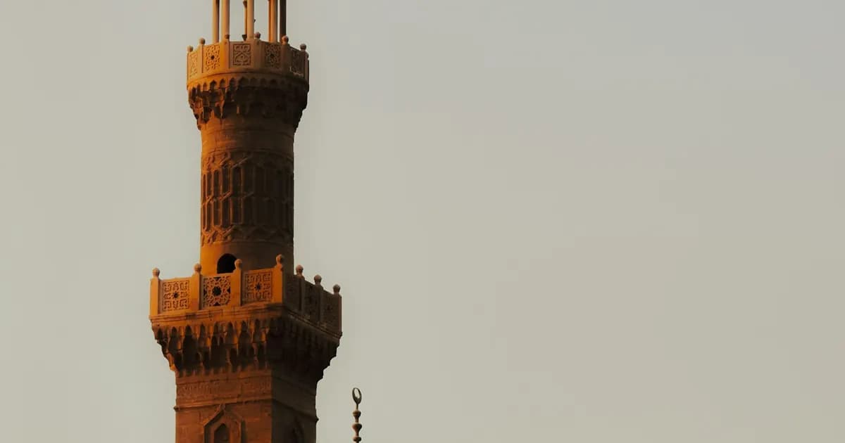 Historic mosque minaret, welcoming students to their first online Quran reading lesson